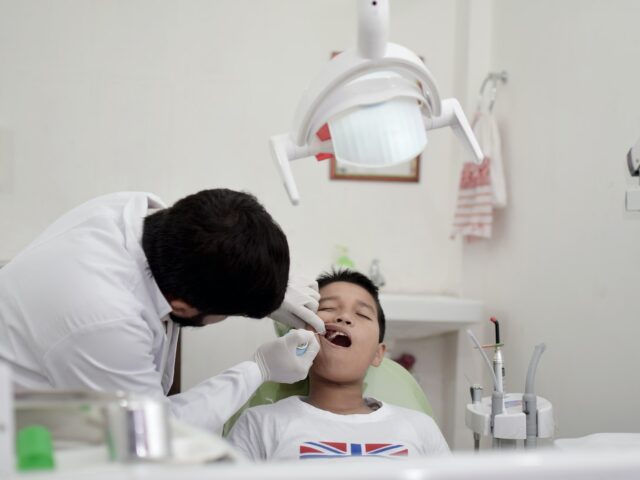 Gentle pediatric dental care with professional dentist